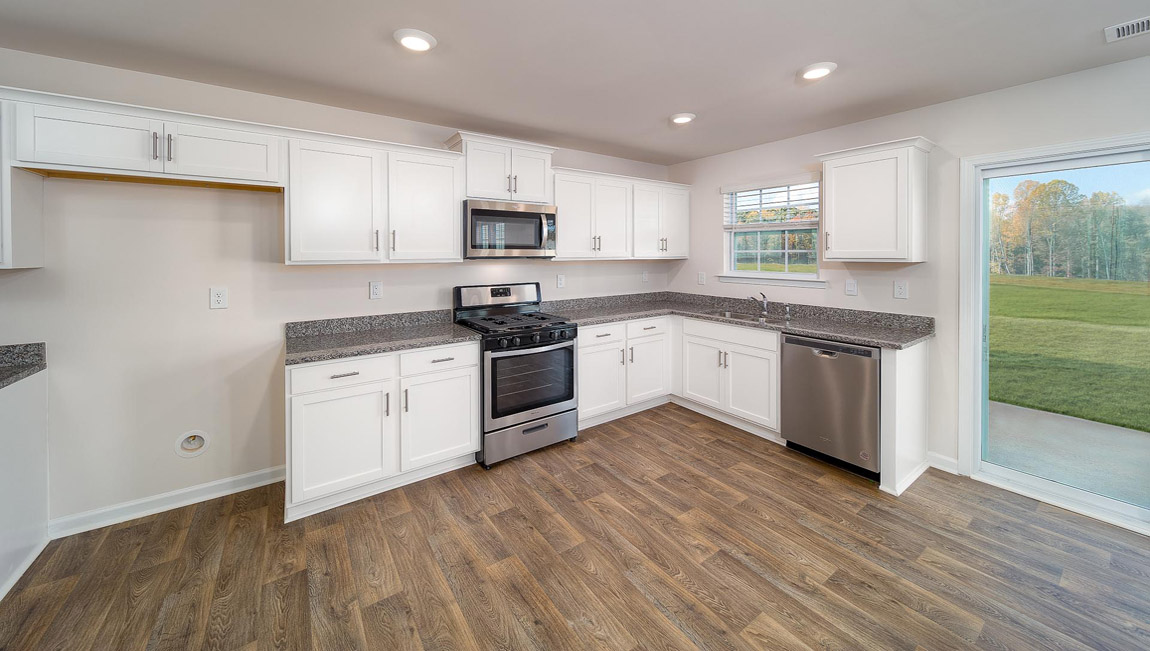 Kitchen and island with granite counter tops.