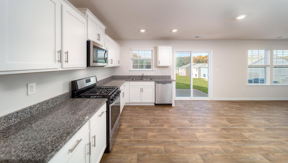 Kitchen and island with granite counter tops.