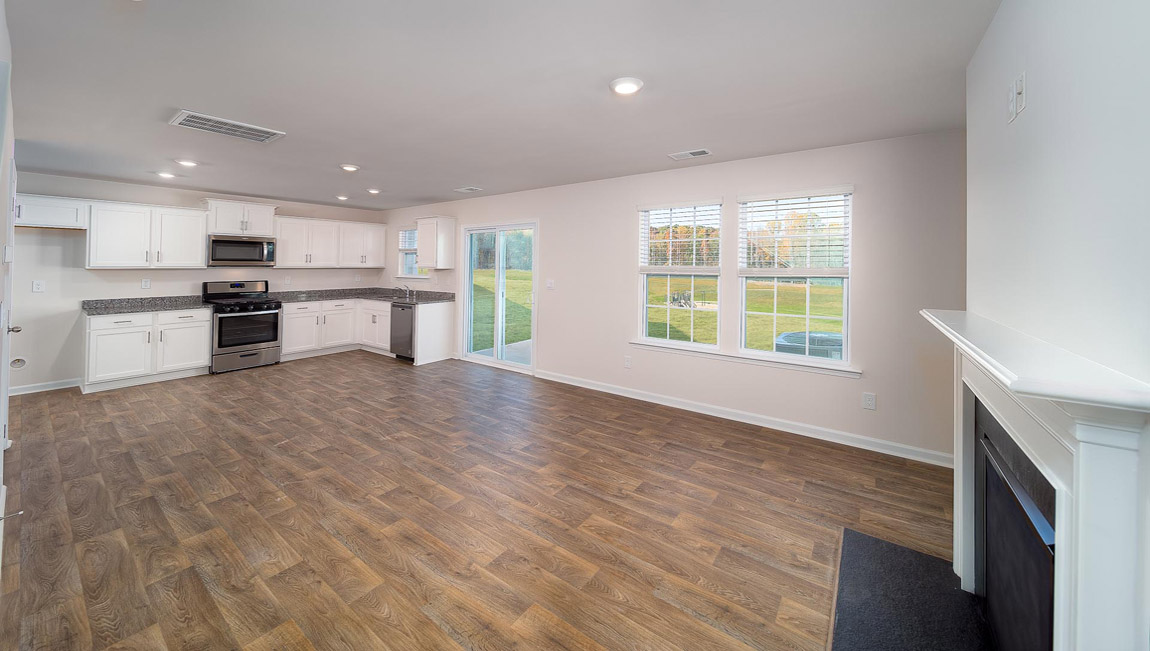 Kitchen and island with granite counter tops.