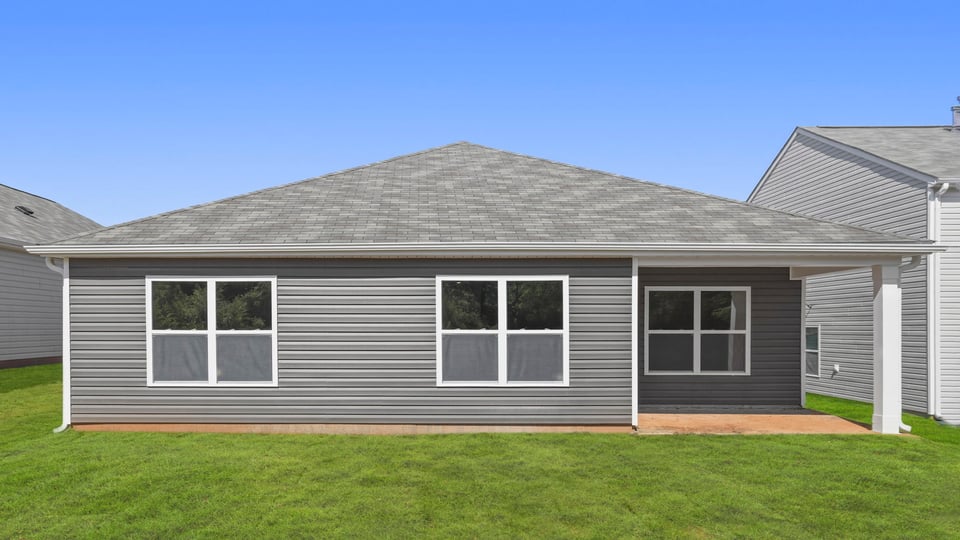 Back exterior with large backyard.