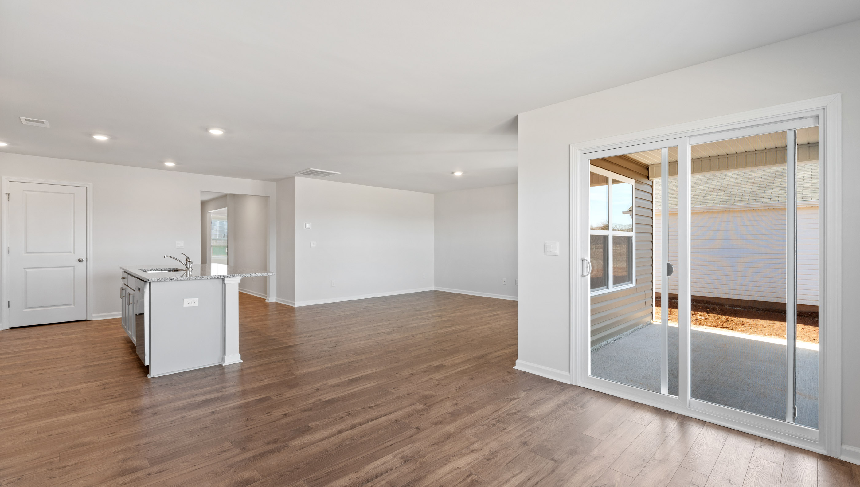 View of dining area and doors to outside patio.