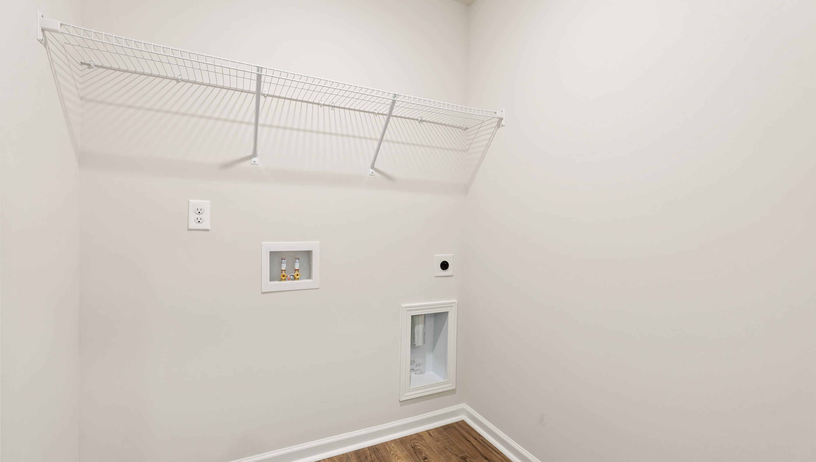 Laundry room with shelving.