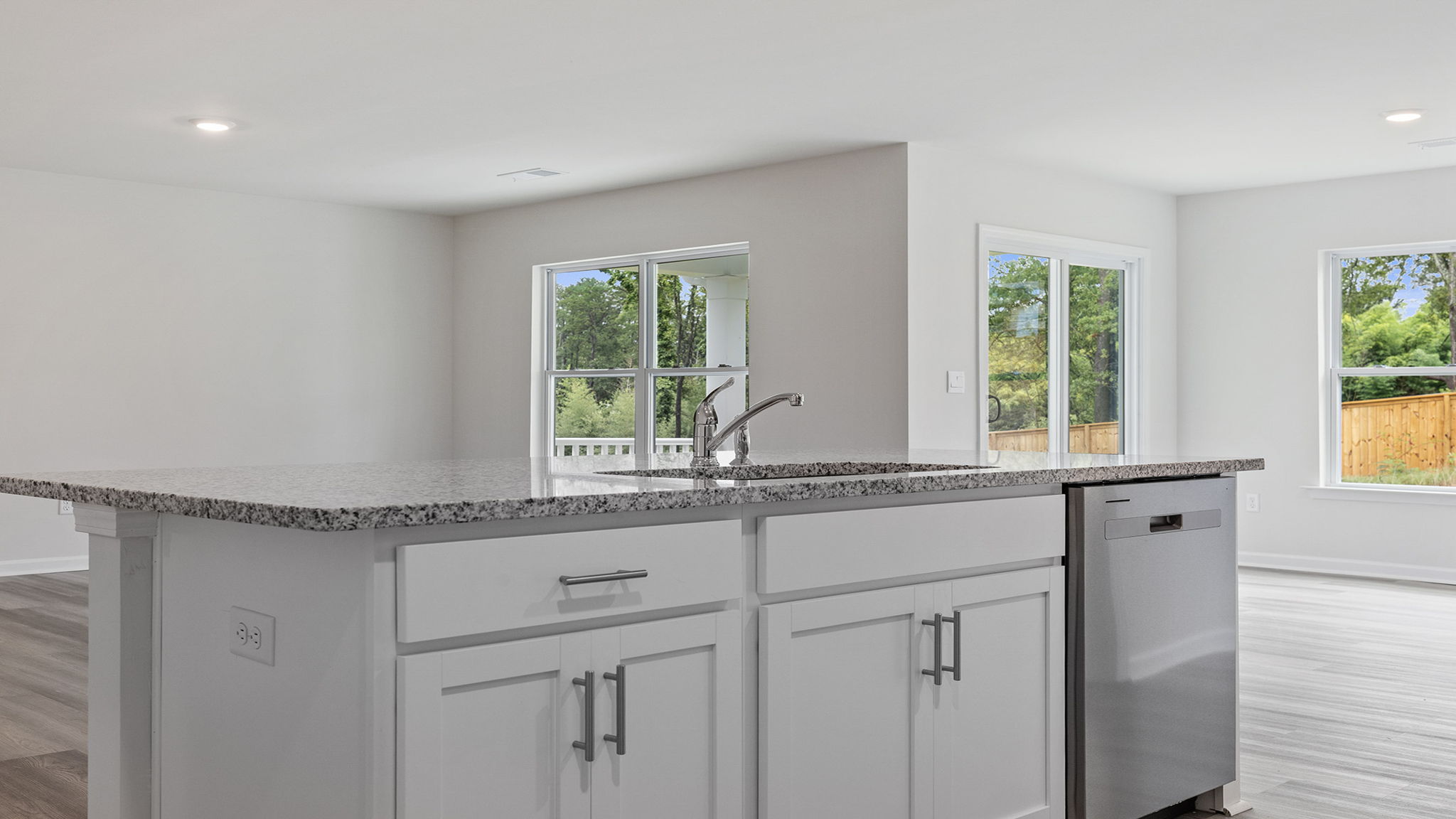 View from kitchen into dining and family rooms.
