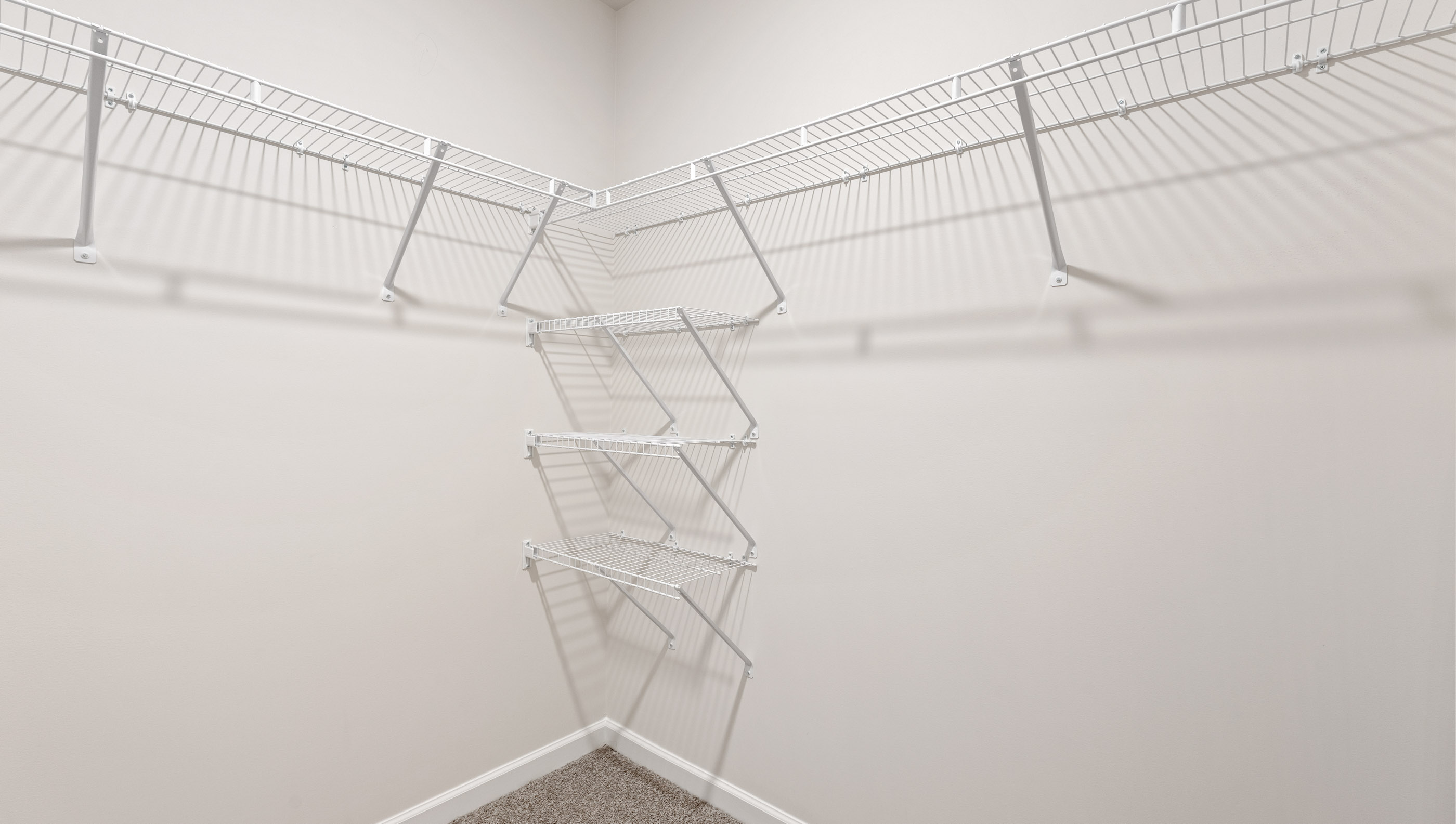 Closet with hanigng storage racks.