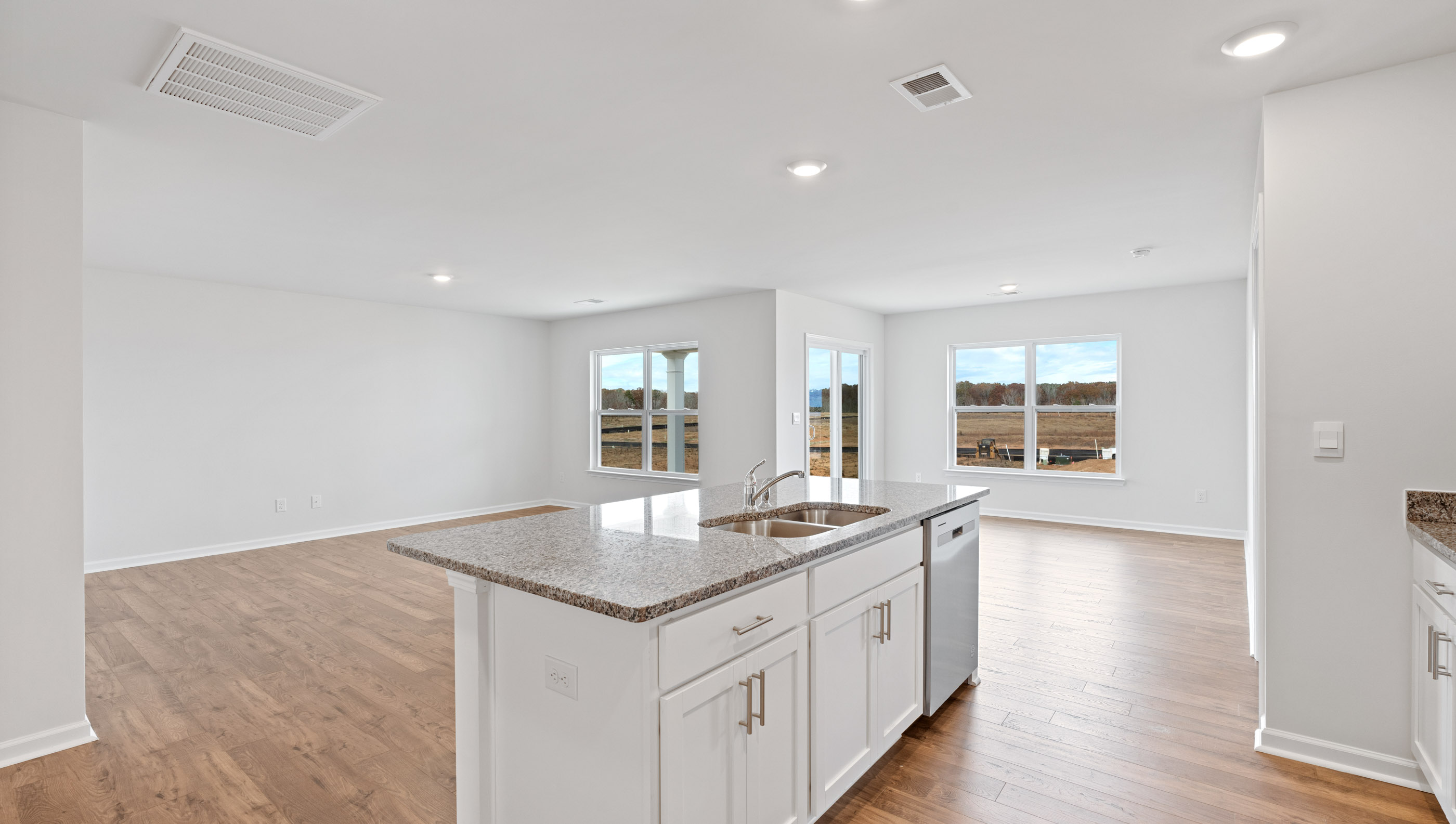 Kitchen and island with granite counter tops.