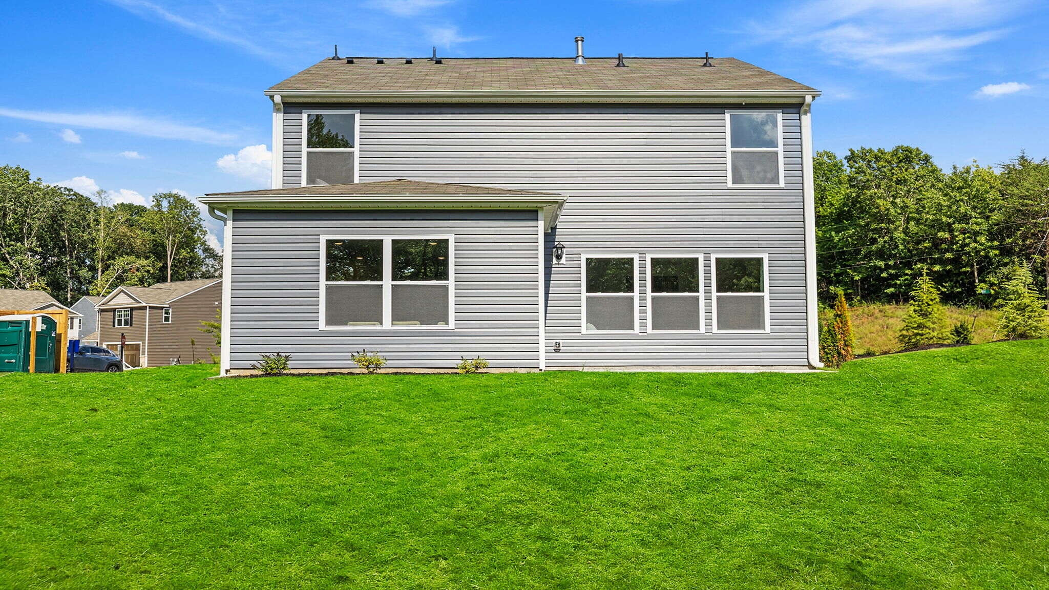 Back exterior with large backyard.