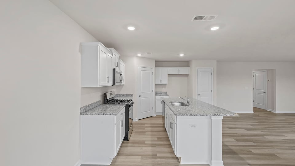 View of hallway to the entrance from the kitchen.