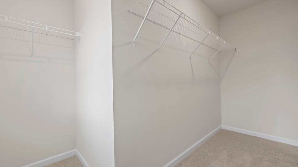 Primary bedroom walk-in closet.
