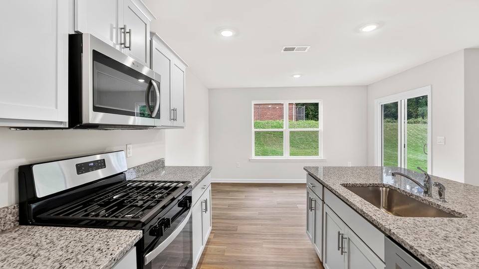 Kitchen with island and cabinets.