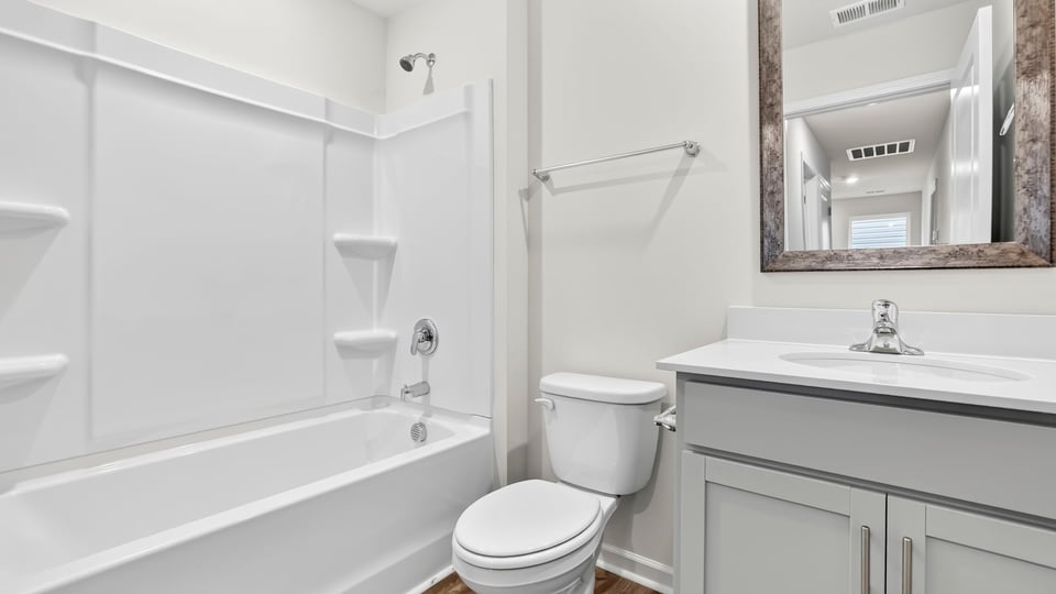 Bathroom with vanity sinks.