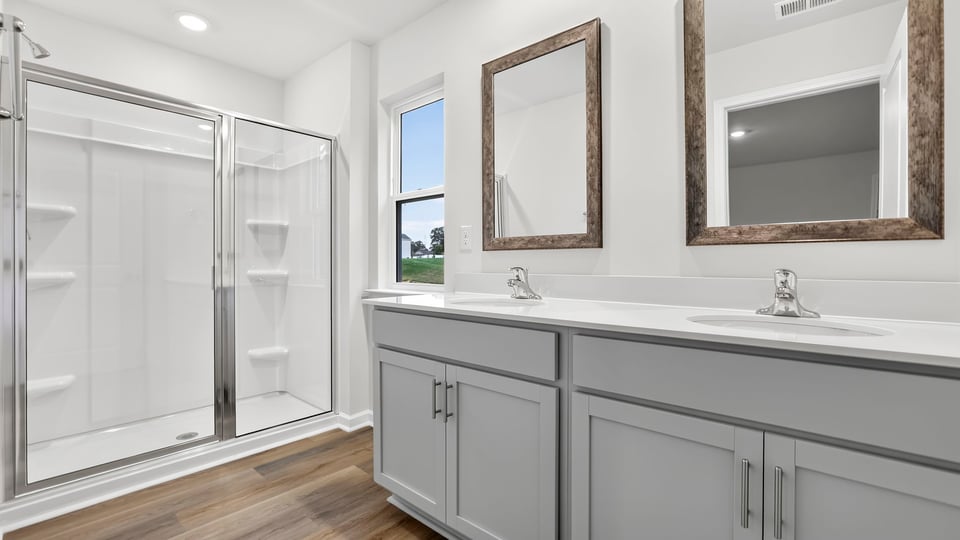 Primary bathroom with double vanity sinks.