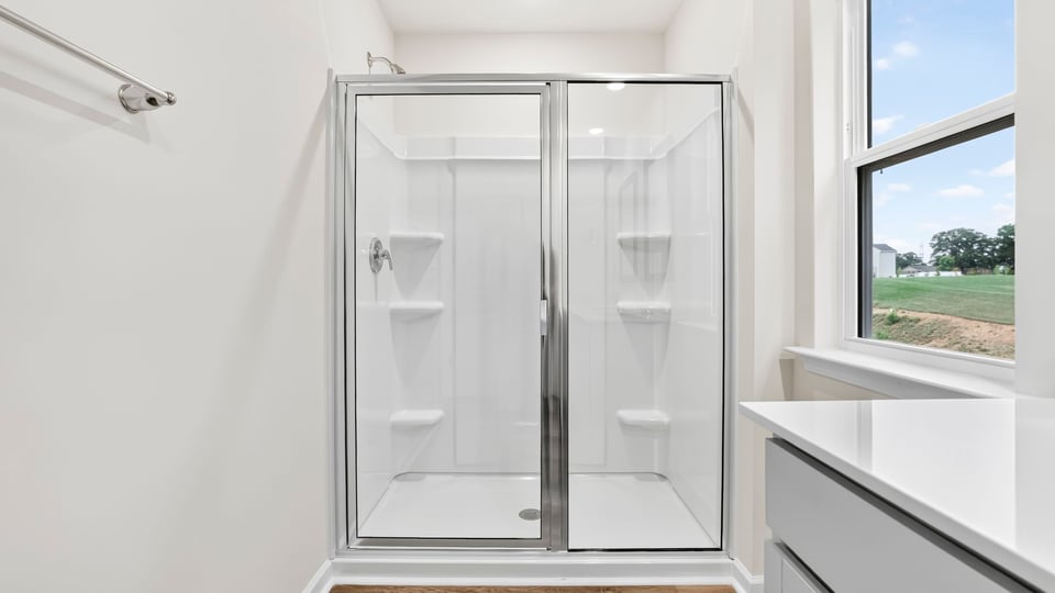 Primary bathroom with double vanity sinks.
