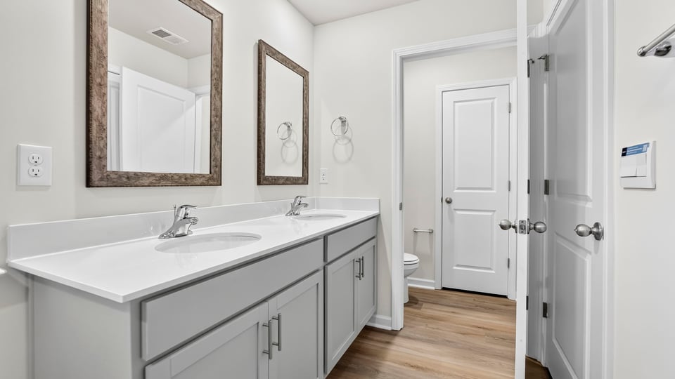 Primary bathroom with double vanity sinks.
