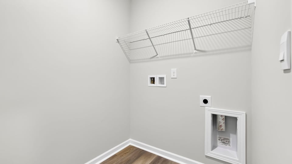 Laundry room with shelf.