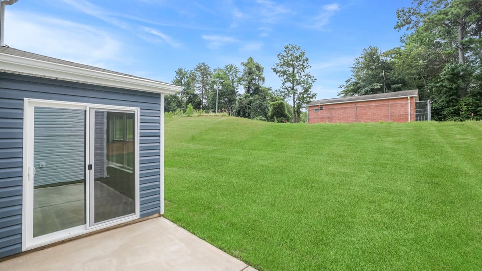 Back exterior with large backyard.