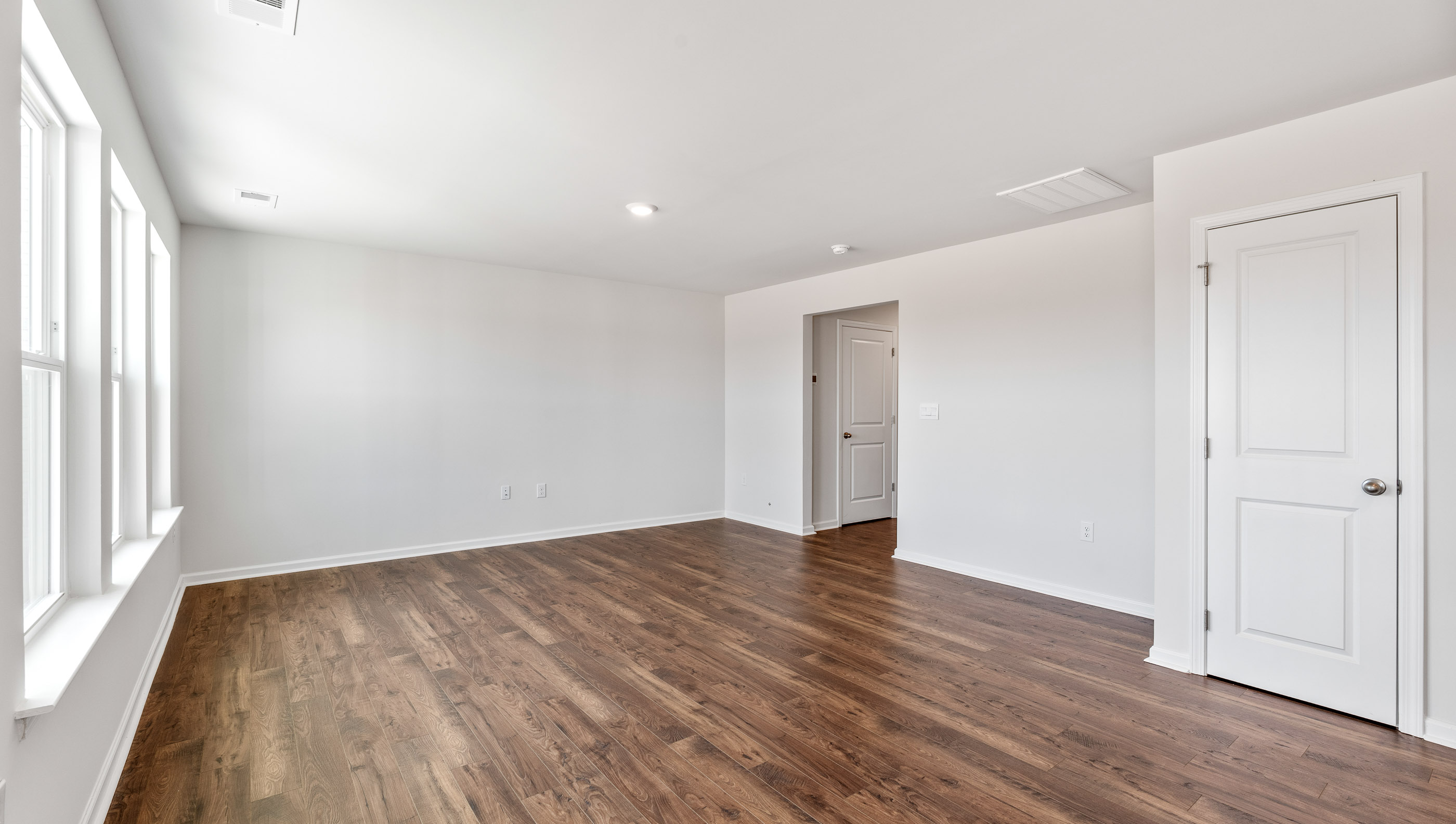 Family room with windows.
