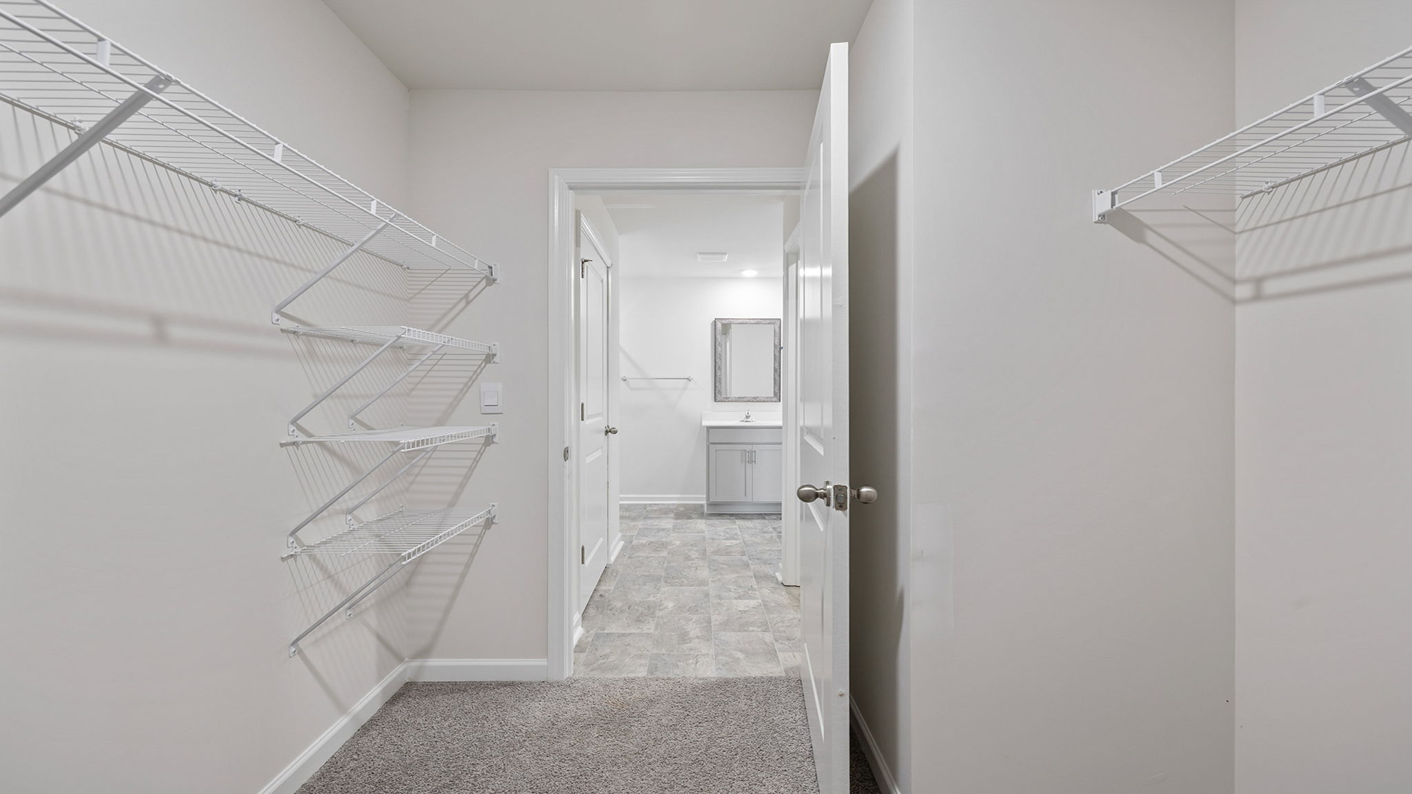 Primary bedroom walk-in closet.