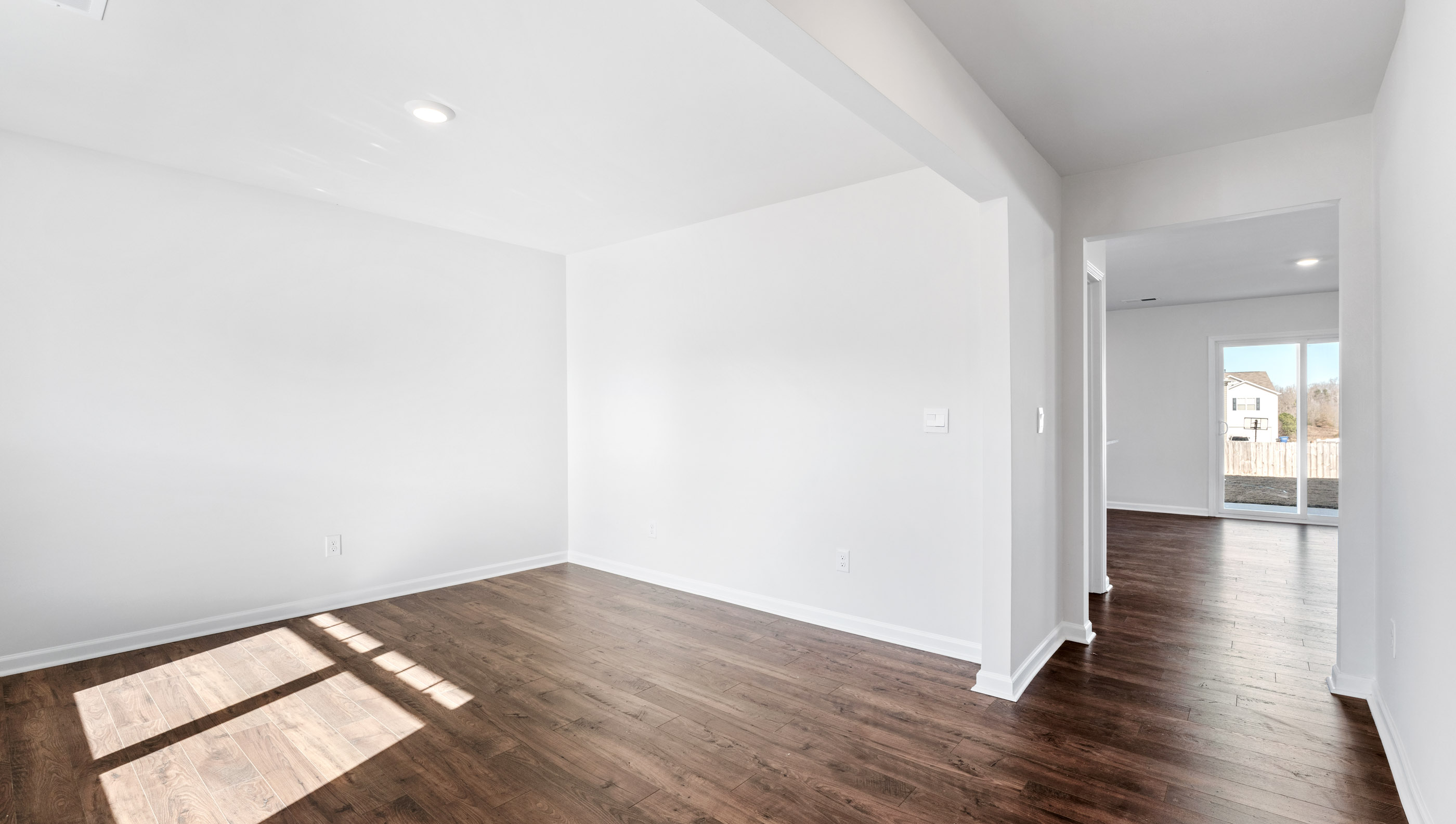 Entry way into home with view of hallway.