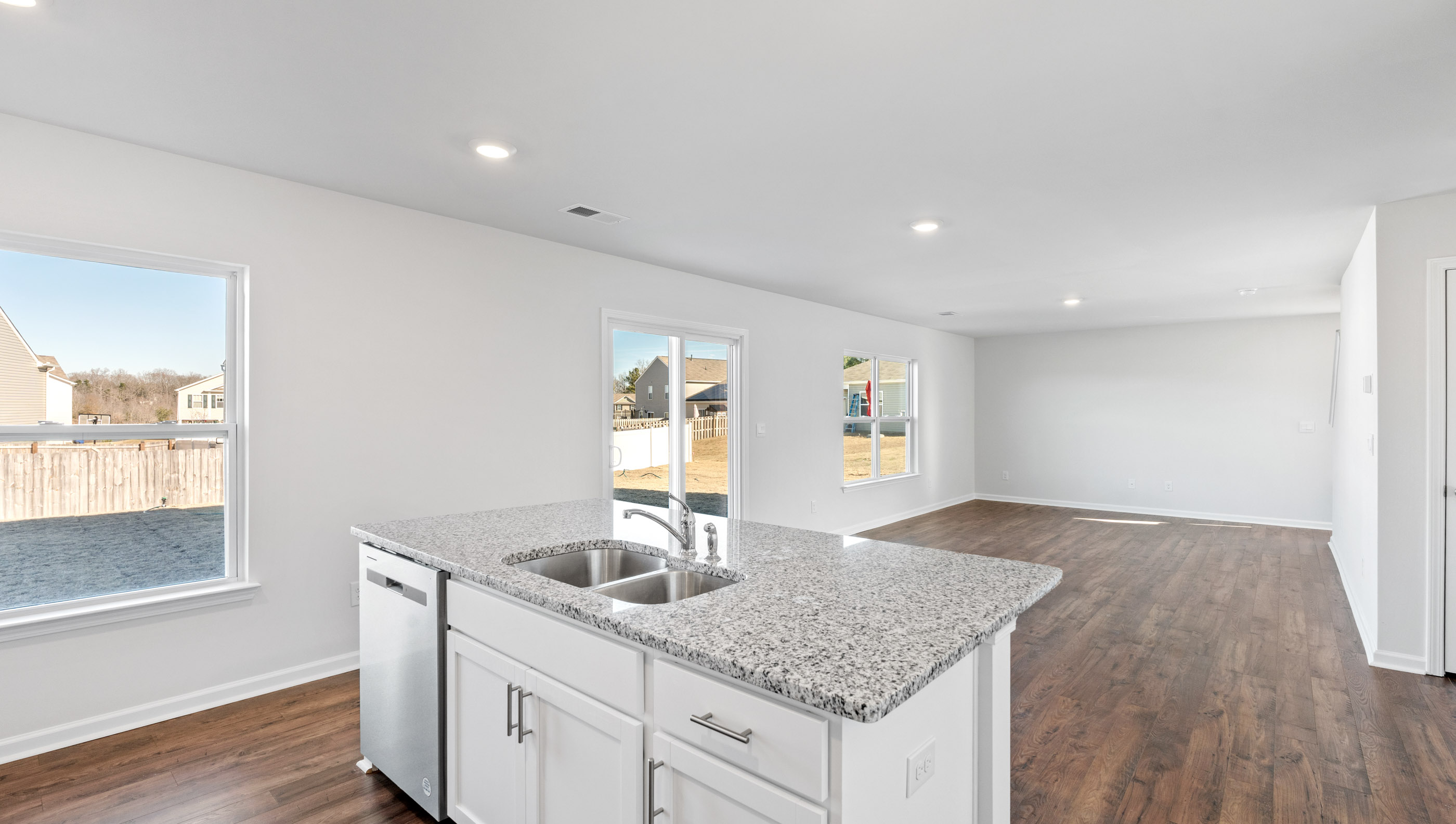 Kitchen and island with granite counter tops.