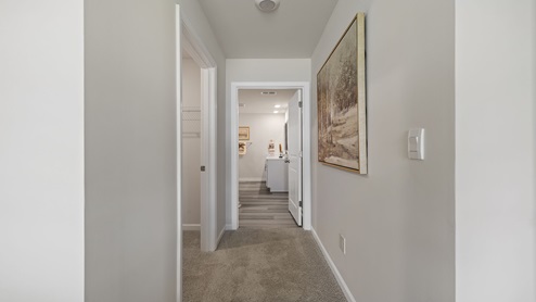 Primary bedroom hallway to bathroom and closet.
