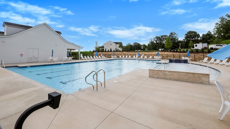 Pool amenity with chairs.