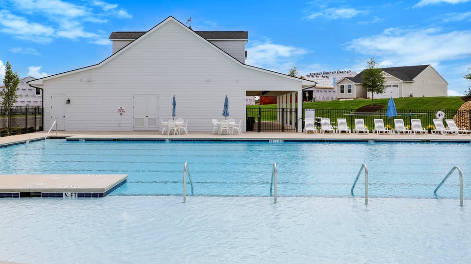 Pool amenity with chairs.