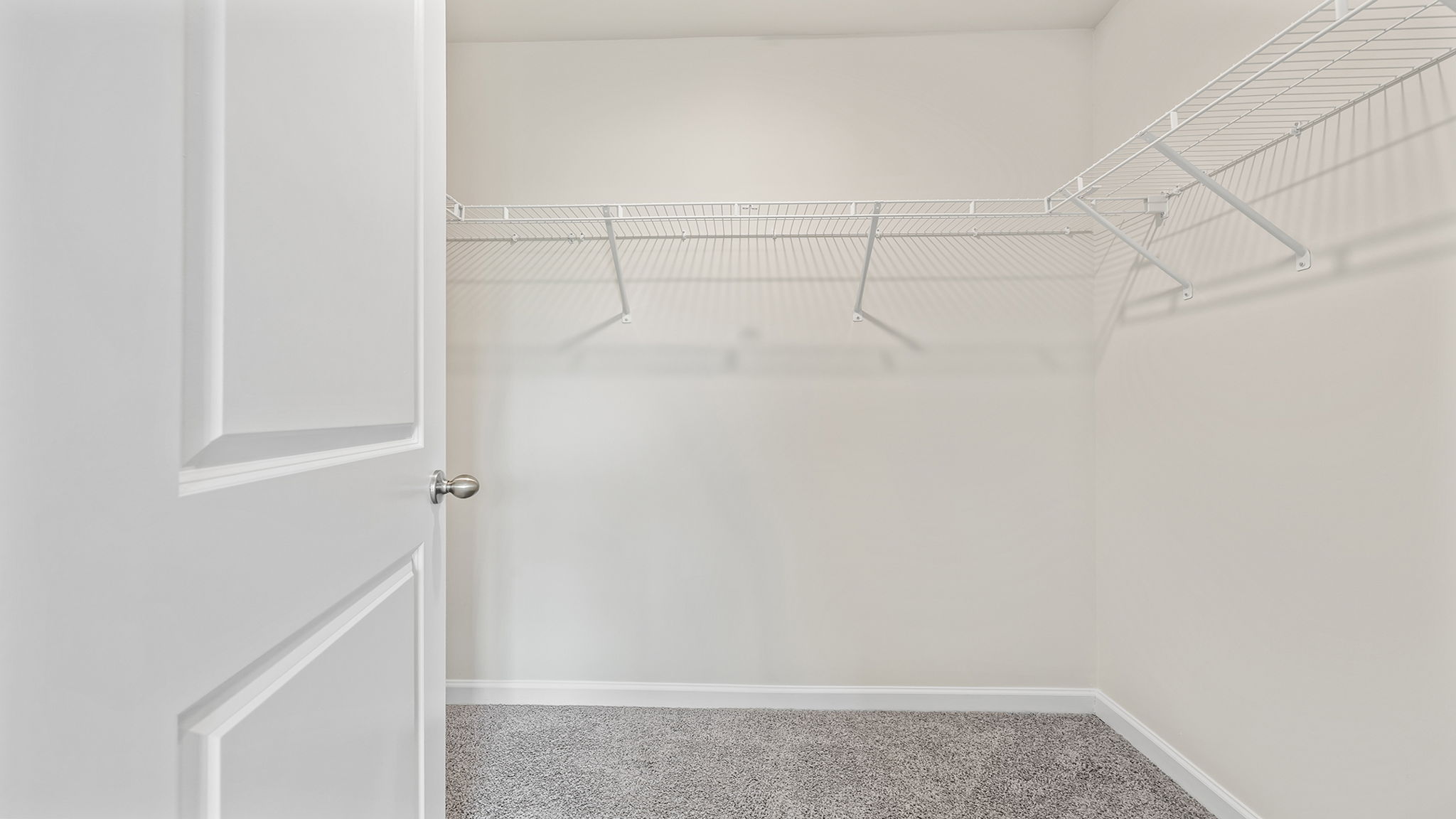 Primary bedroom walk-in closet.