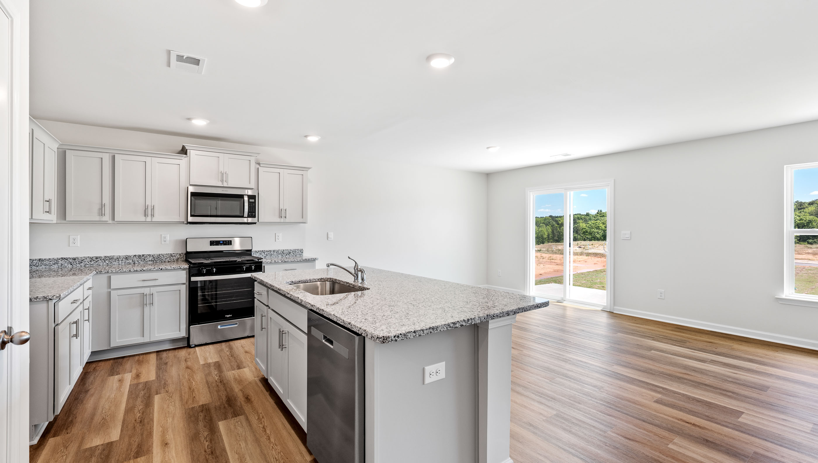 Kitchen with island and granite counter tops.