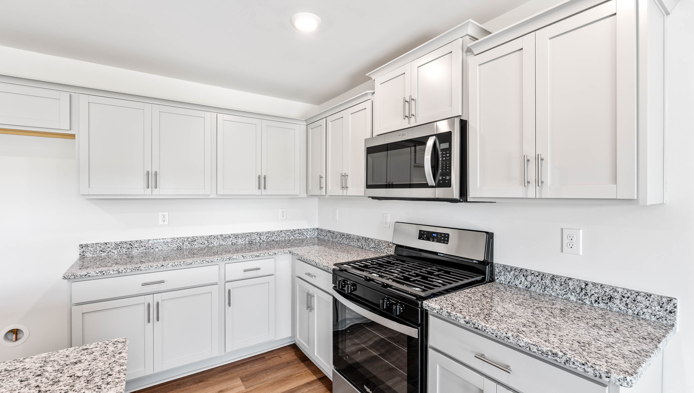 Kitchen with island and granite counter tops.