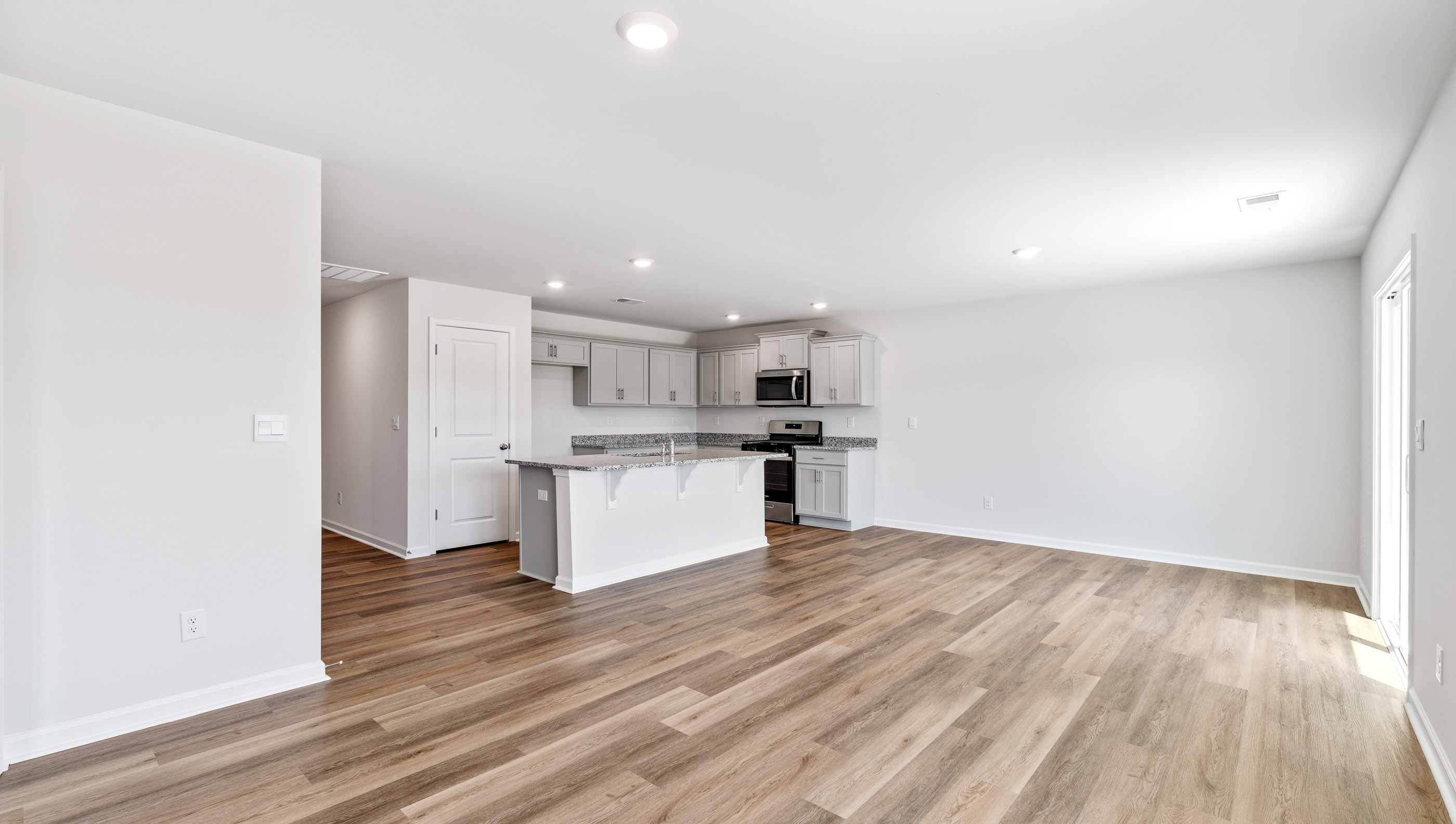 View of Family room, Dining area and Kitchen.