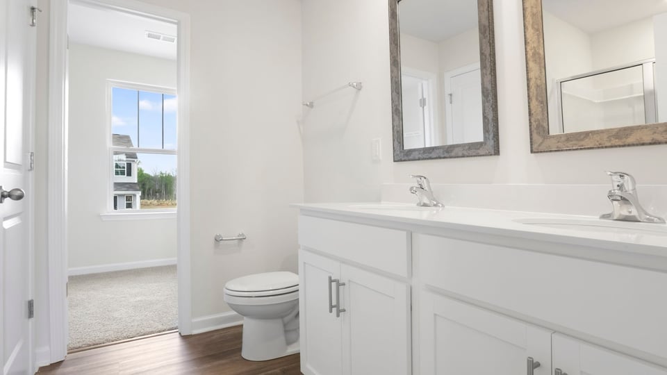 Primary bathroom with double vanity sink.