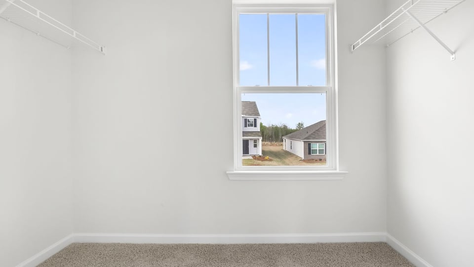 Primary closet with window.
