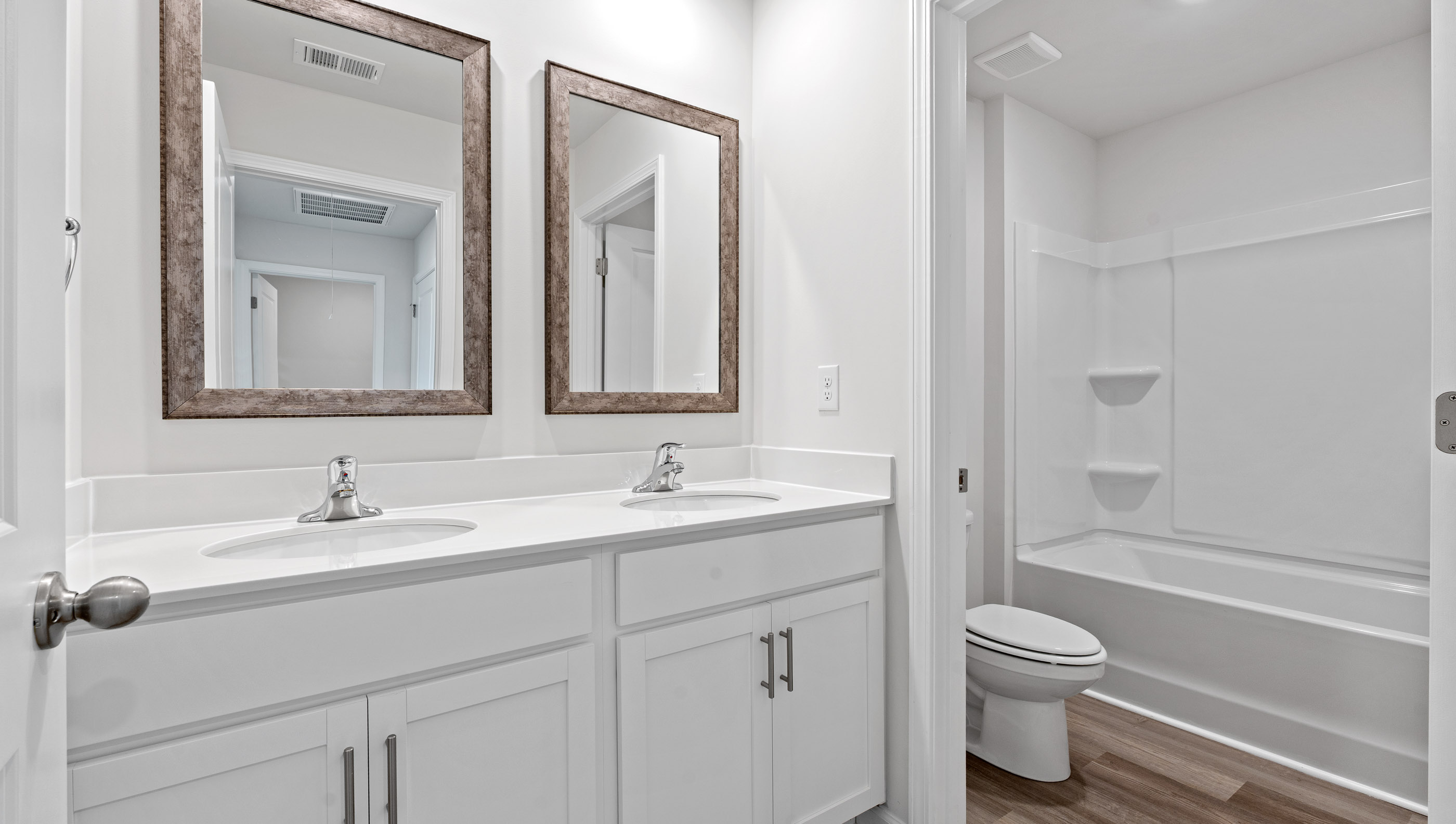 Bathroom with double vanity sinks.