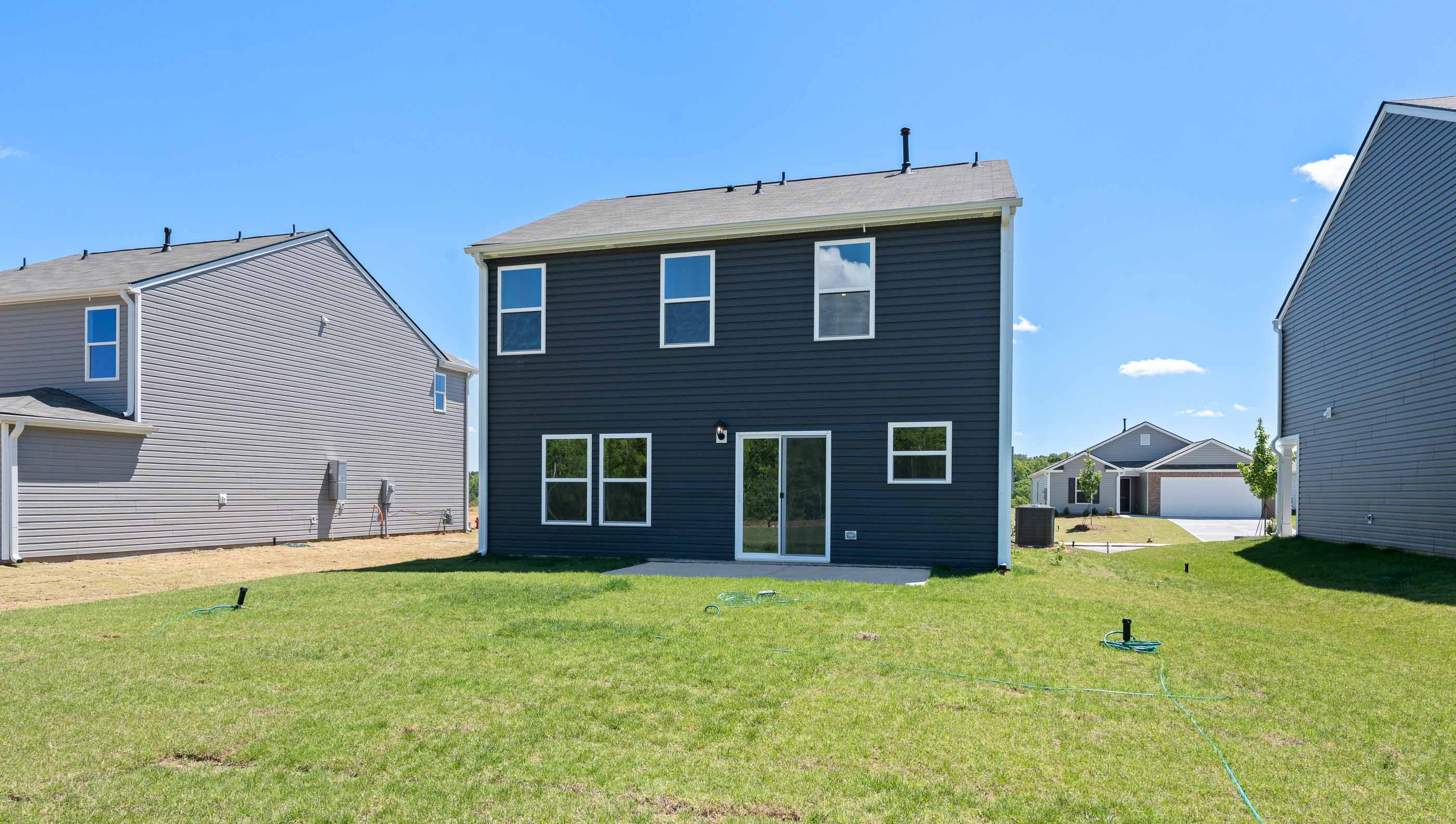 Back exterior with large backyard.