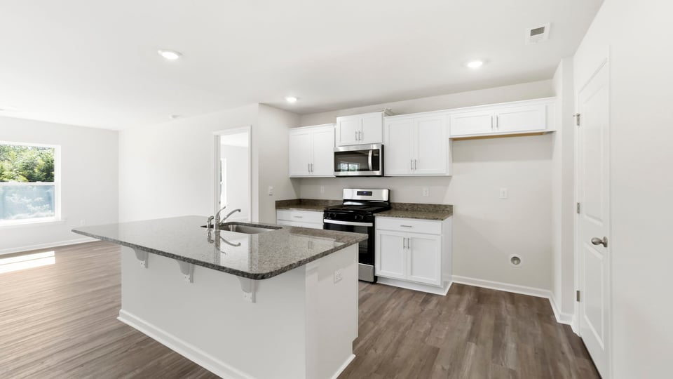 Kitchen with island and cabinets,