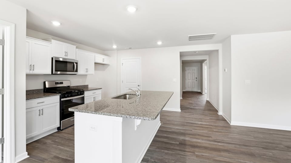 Kitchen with island and cabinets,