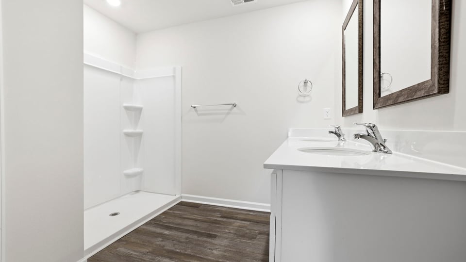 Primary bathroom with double vanity sinks.