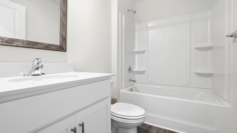 Bathroom with vanity sinks.