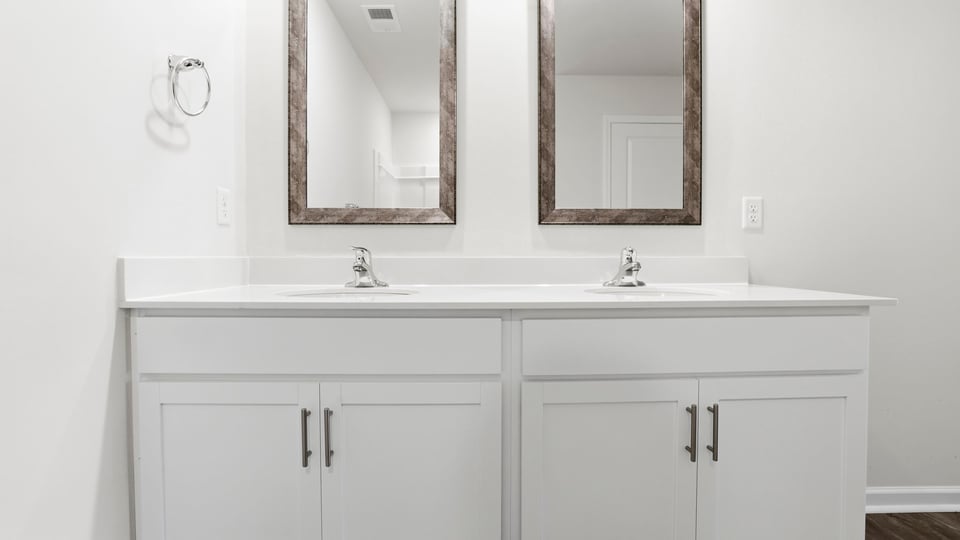 Primary bathroom with double vanity sinks.