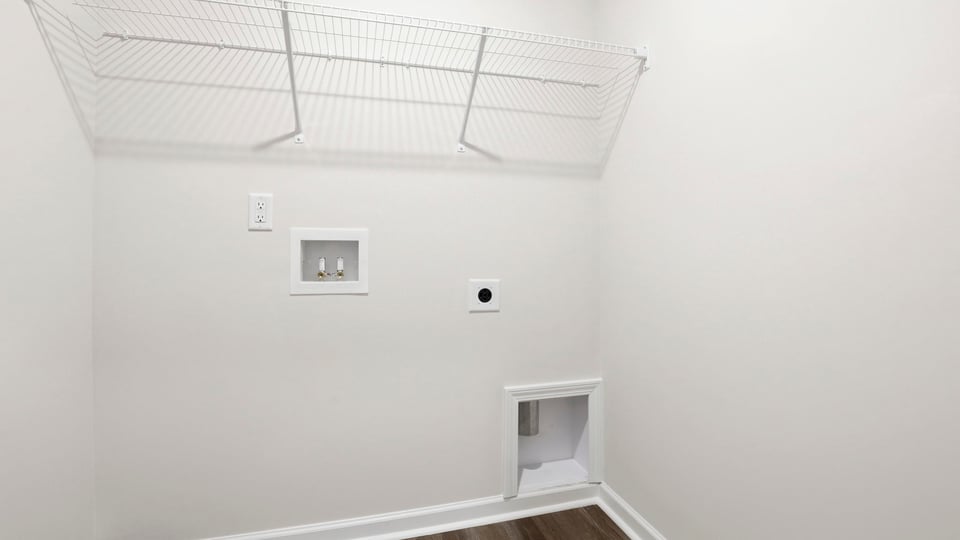 Laundry room with shelf.