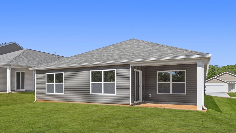 Back exterior with large backyard.