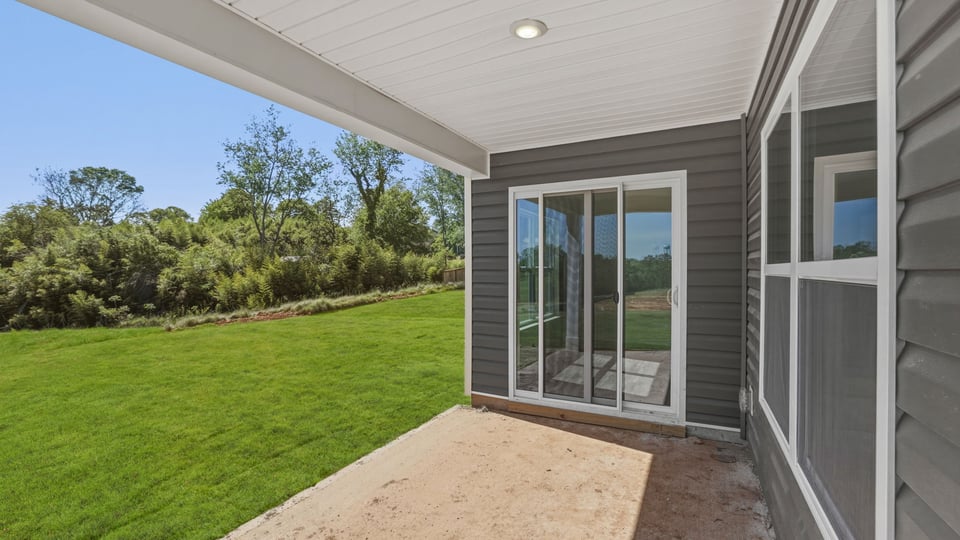 Back exterior with large backyard.