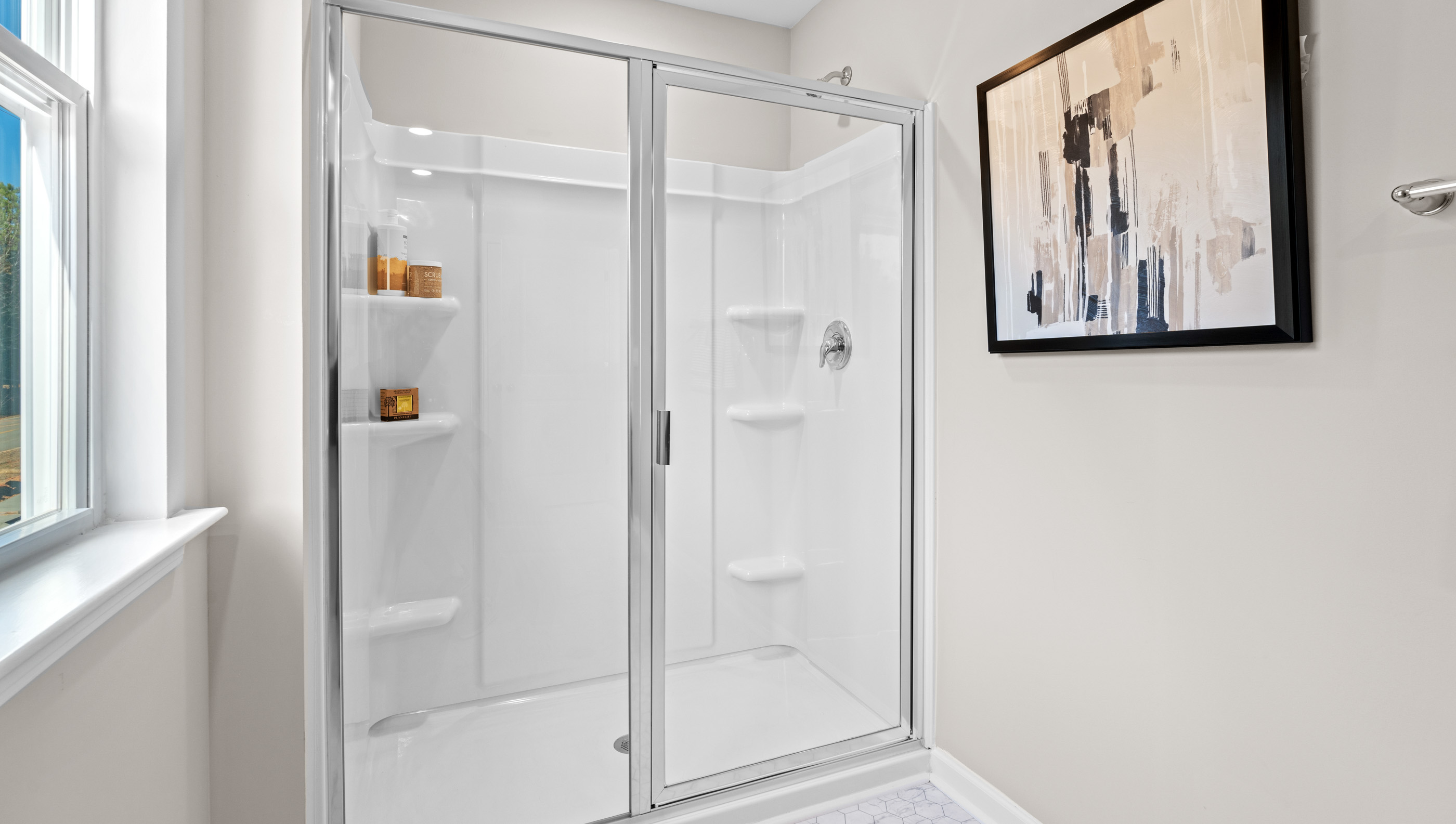 Bathroom with walk in shower.