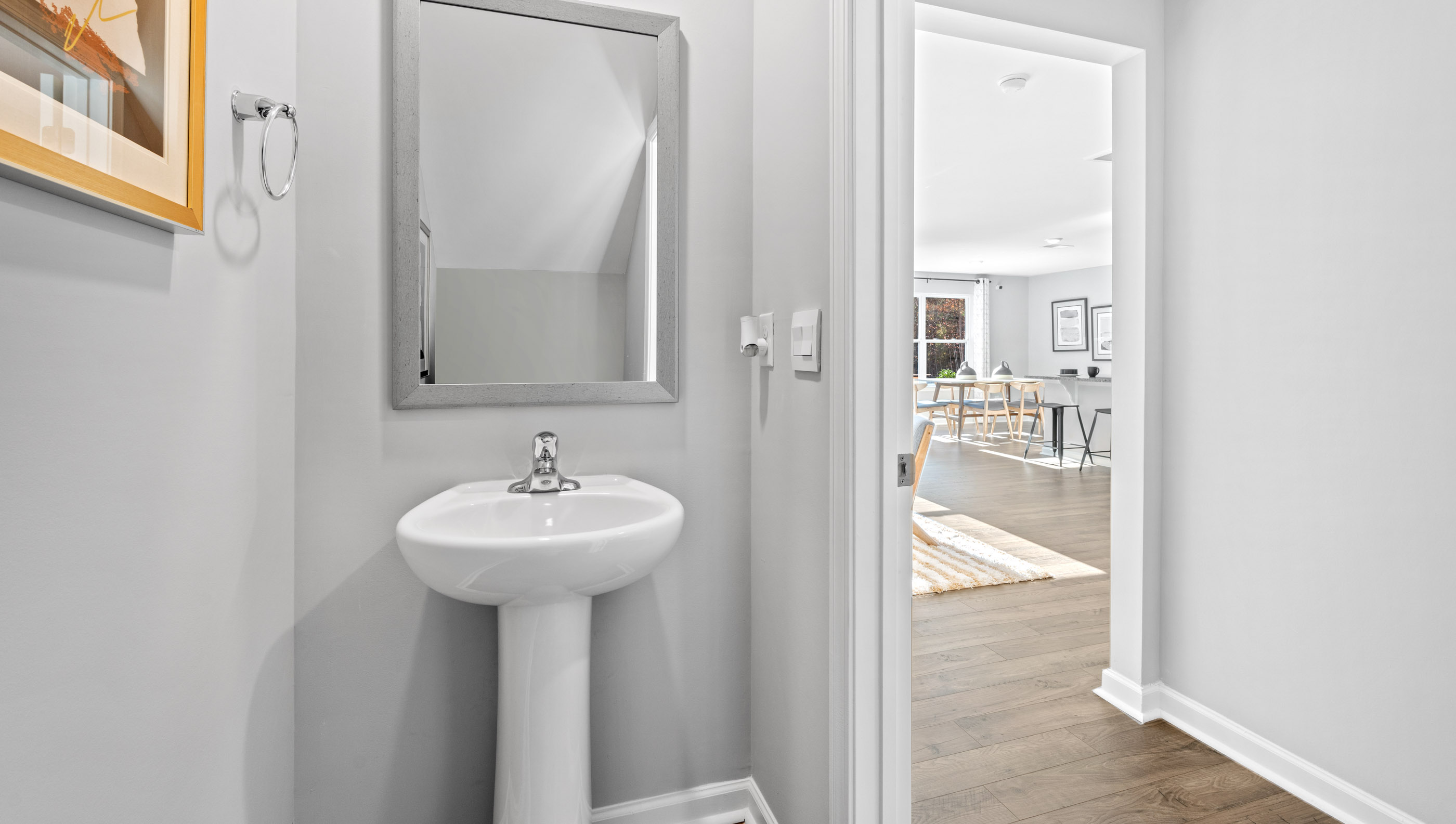 Half bathrom with mirror.