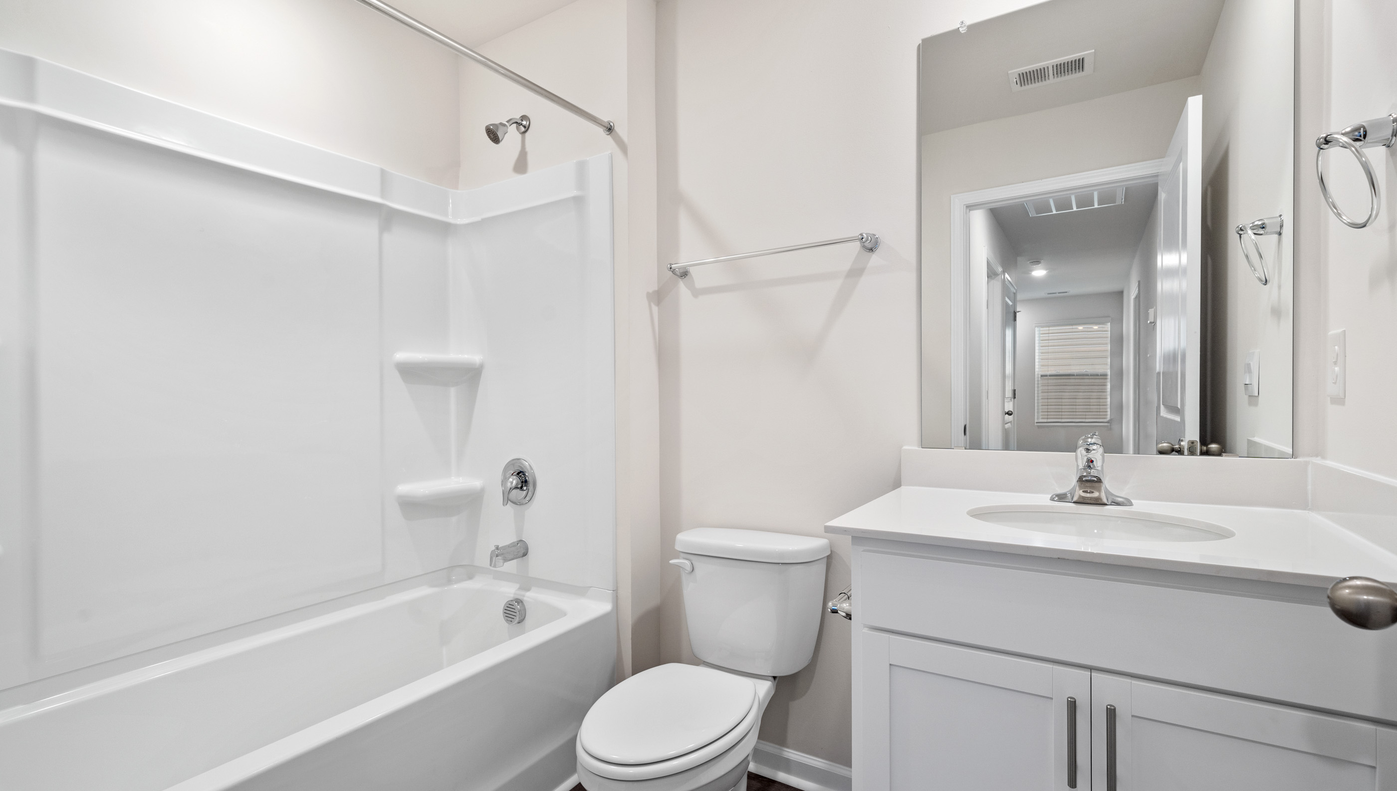 Bathroom with vanity and tub.