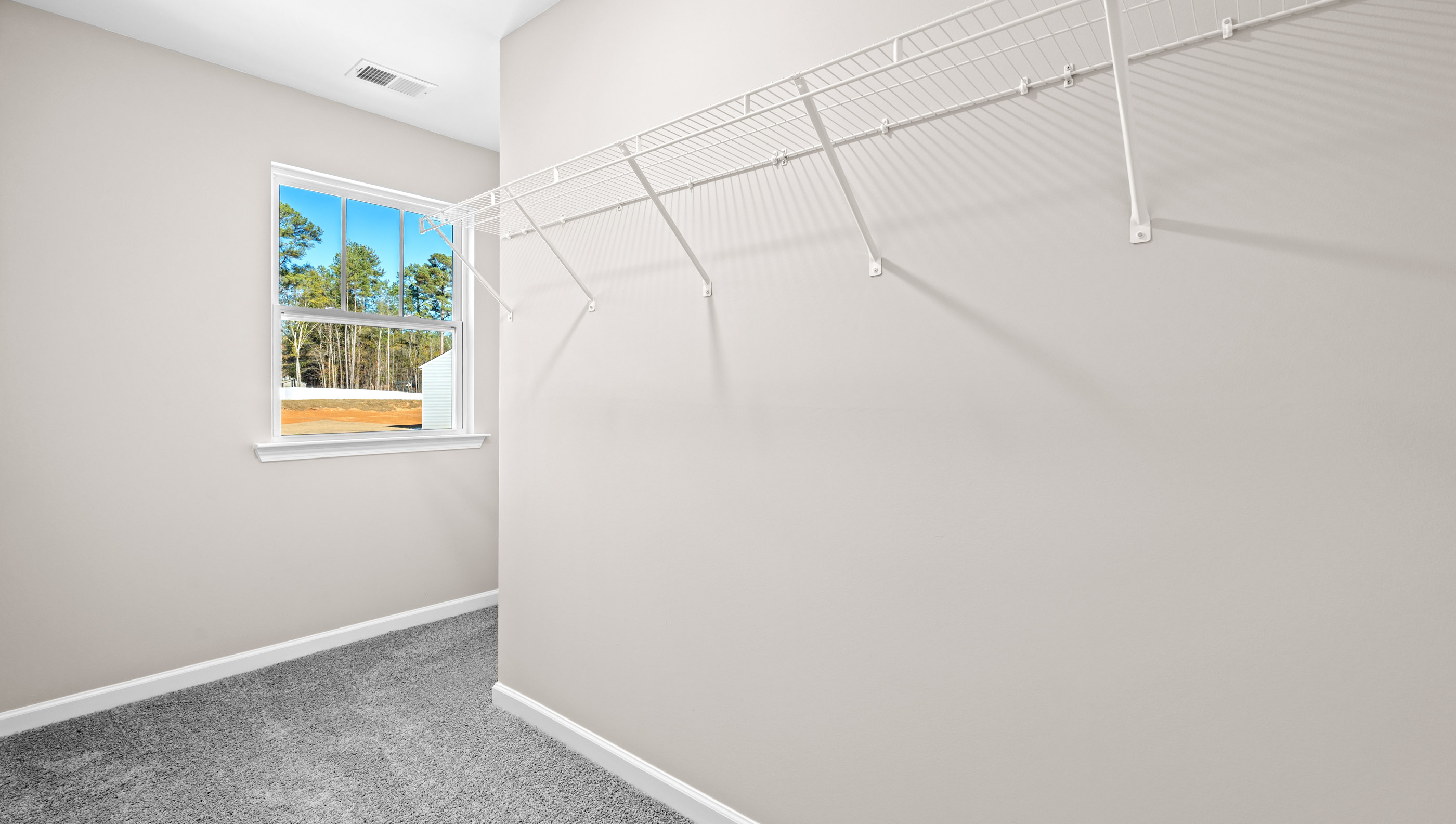 Closet with hanging storage racks.