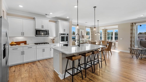 Kitchen and island with granite counter tops.