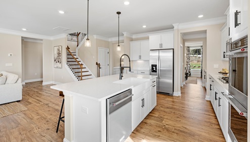 Kitchen and island with view of home.