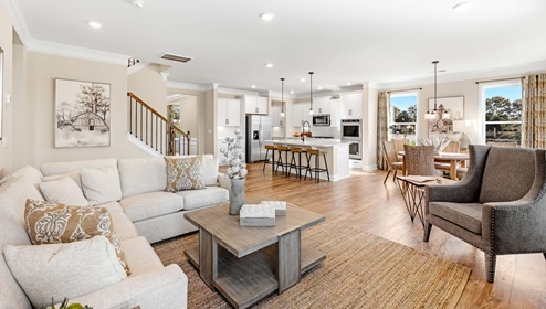 Family room with fireplace and windows.