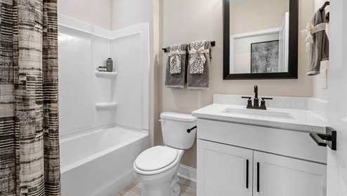 Bathroom with single vanity sink and shower.